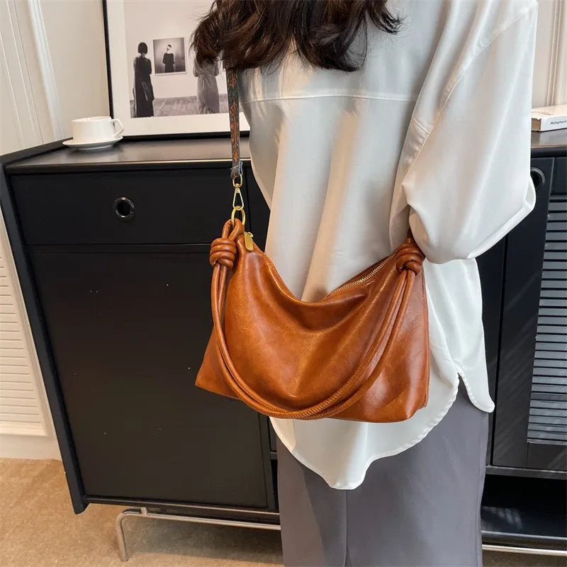 Nuevo bolso de mujer a la moda, textura de cuero suave de alta gama, bolso de un solo hombro, bolso cruzado para mujer, hombro ancho geométrico