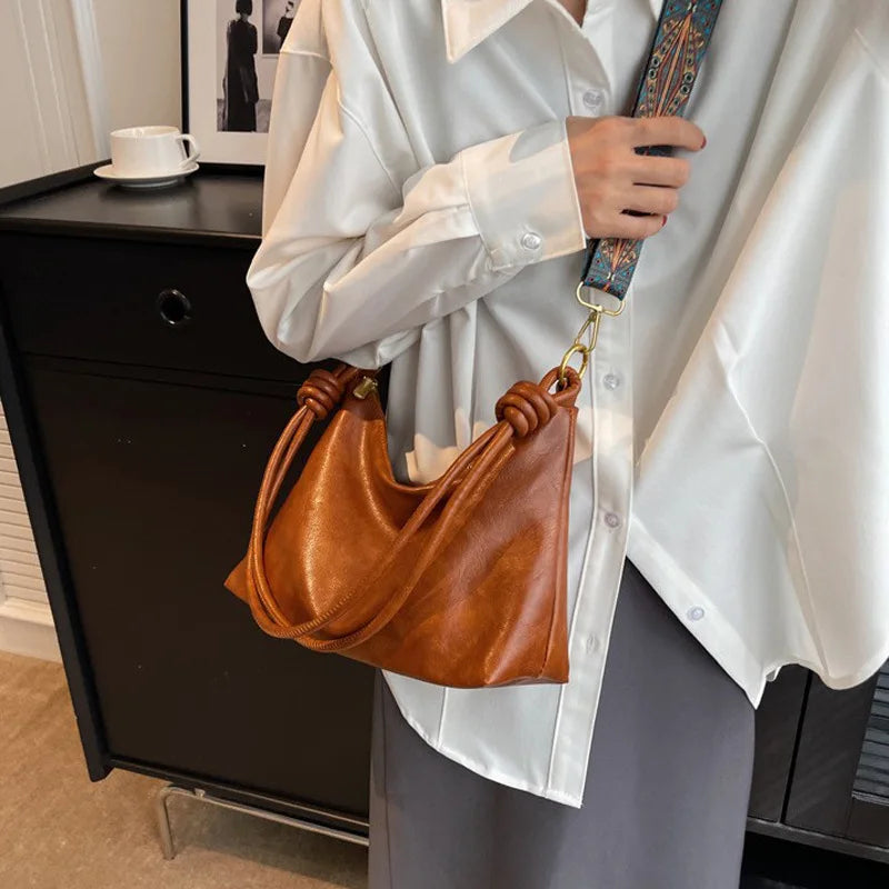 Nuevo bolso de mujer a la moda, textura de cuero suave de alta gama, bolso de un solo hombro, bolso cruzado para mujer, hombro ancho geométrico