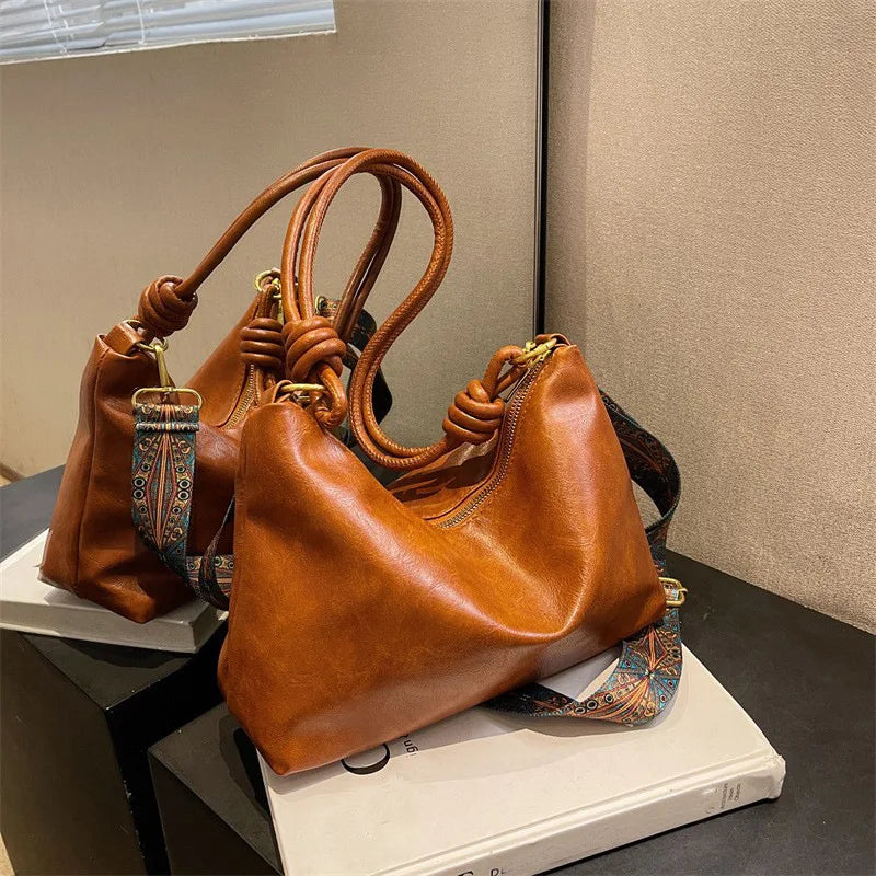 Nuevo bolso de mujer a la moda, textura de cuero suave de alta gama, bolso de un solo hombro, bolso cruzado para mujer, hombro ancho geométrico